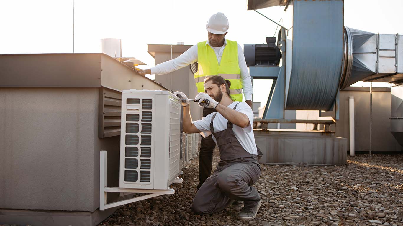 diverse plant workers repairing air conditioner on 2023 12 21 22 00 43 utc