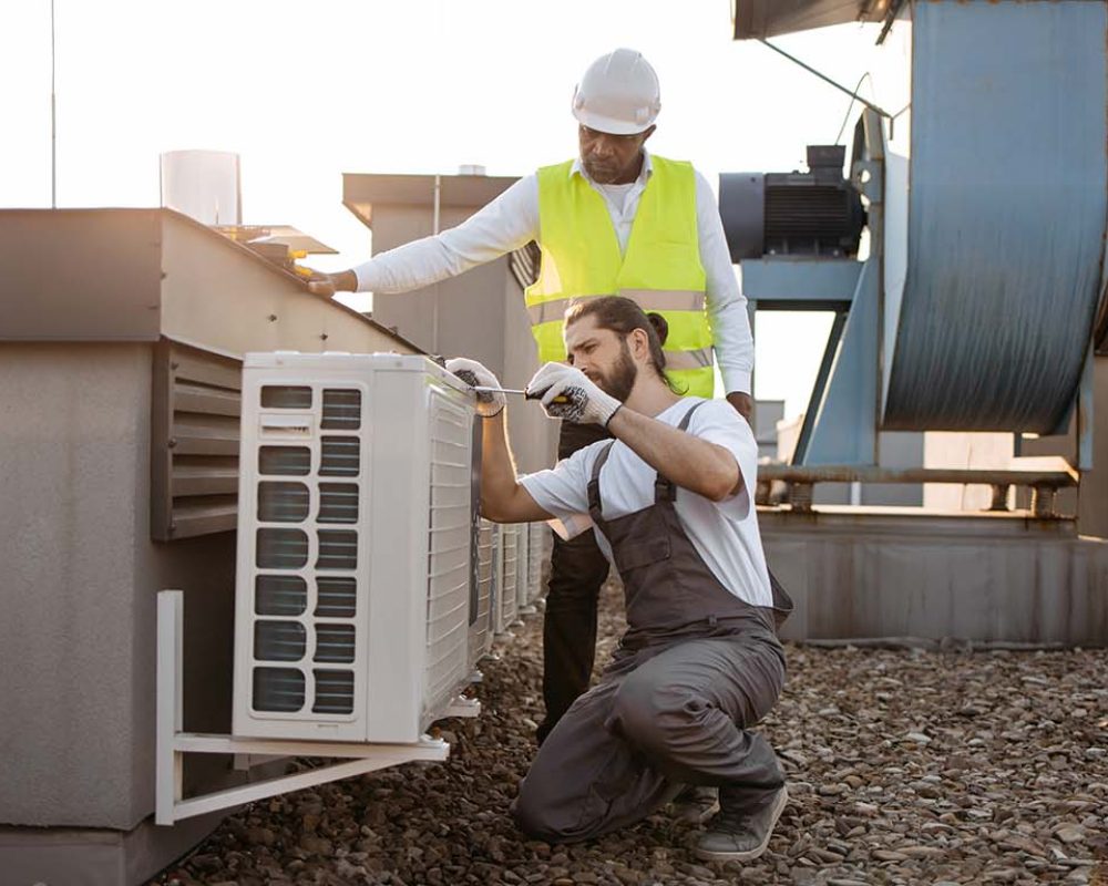 diverse plant workers repairing air conditioner on 2023 12 21 22 00 43 utc